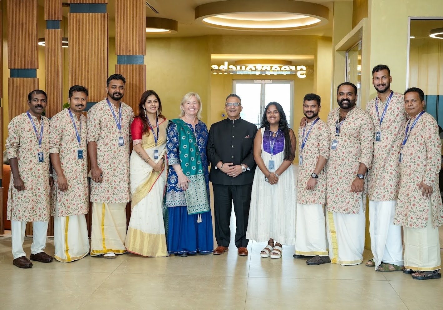 Group of colleagues posing together at new Kochi office opening
