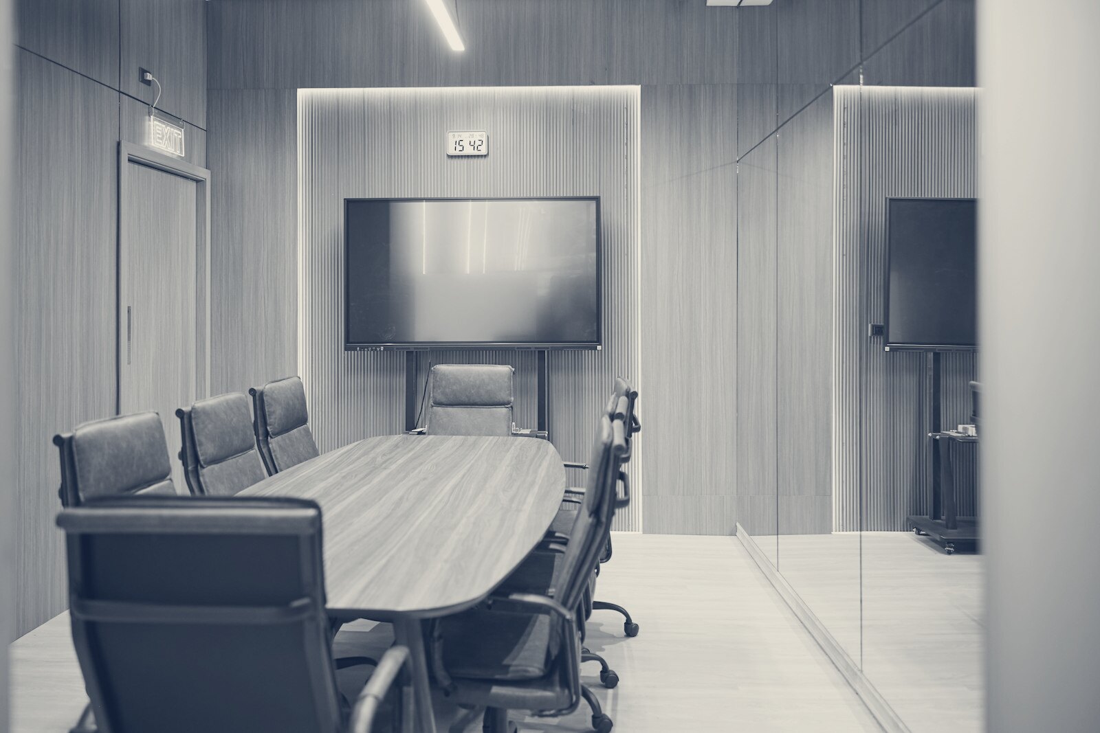 Modern conference room with oval table and chairs