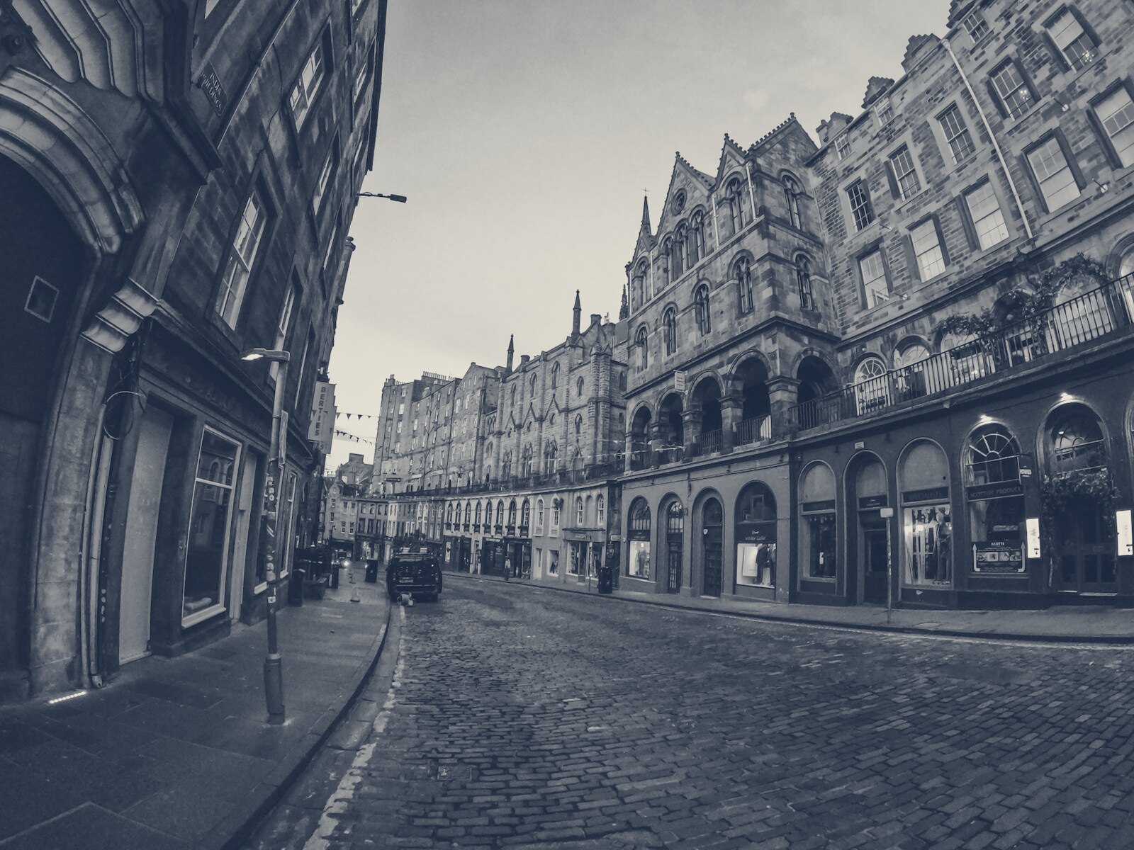 a cobblestone street with buildings on either side of it