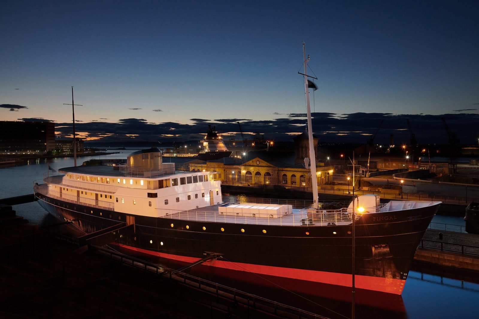 Fingal floating hotel ship docked at Leith at dusk