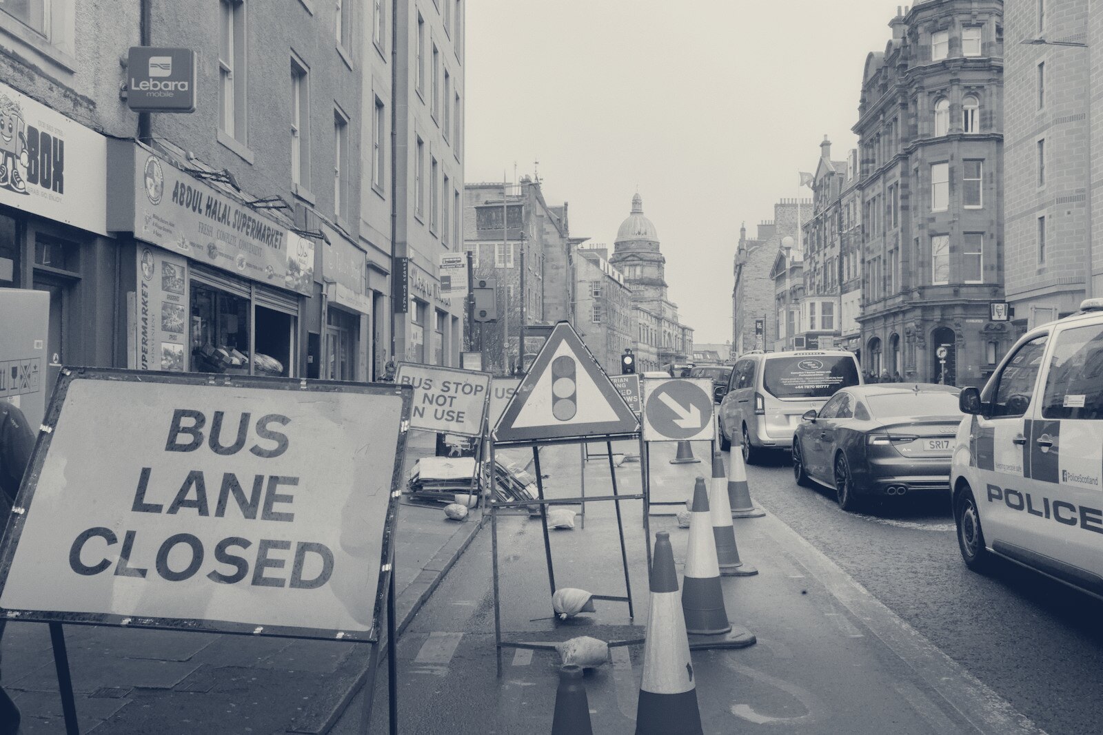 Bus lane closed with traffic cones and signs